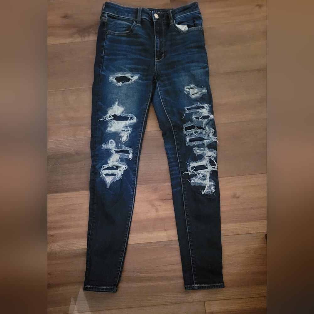 Distressed high-waisted skinny jeans